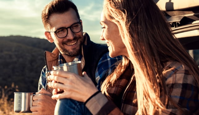Man and woman sharing a drink